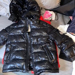 A black moncler Coats. Size 2T for kids. Unisex